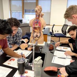 Biology students working in lab.